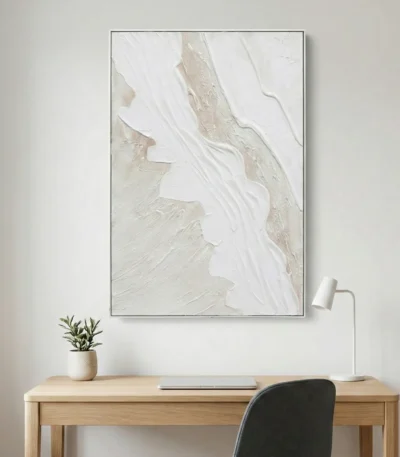 Textured abstract hand-painted canvas in cream, white and pale taupe with gestural brushwork, modern workspace