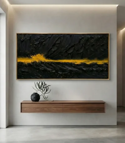 Textured abstract hand-painted canvas with dramatic black brushstrokes and golden horizon line, contemporary interior setting