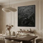 Gestural abstract expressionist hand-painted canvas in dramatic black impasto brushstrokes, contemporary dining space