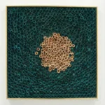 Textured contemporary wall art featuring natural wooden rings clustered on hand-painted teal canvas with gold frame