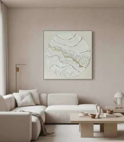 Textured abstract hand-painted canvas with layered cream and gold leaf topography in circular composition, contemporary living space