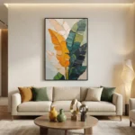 Contemporary hand-painted canvas featuring layered botanical leaves in golden orange, soft cream, and deep teal tones, modern living space