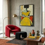Abstract expressionist hand-painted canvas featuring bold yellow figure in geometric composition with red and green accents, contemporary living space
