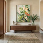 Painterly floral hand-painted canvas with layered pink, coral and green botanicals in contemporary hallway