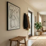 Minimalist black ink line drawing on cream hand-painted canvas with organic flowing forms, entryway setting