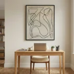 Minimalist abstract hand-painted canvas with continuous black line gestures on cream ground, contemporary workspace
