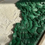 Textured abstract hand-painted canvas with layered green brushstrokes and cream base, contemporary wall art