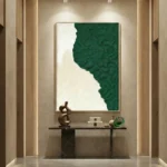Textured abstract hand-painted canvas in forest green and cream with organic gestural brushwork, contemporary entryway setting