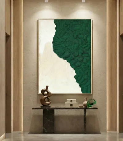 Textured abstract hand-painted canvas in forest green and cream with organic gestural brushwork, contemporary entryway setting