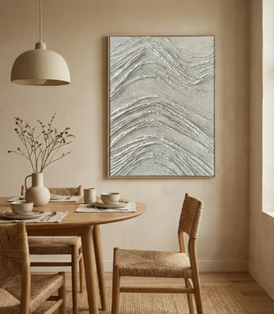 Textured abstract hand-painted canvas with layered cream and silver wave patterns, contemporary dining space