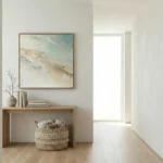 Textured abstract hand-painted canvas in layered cream, taupe and soft teal tones, contemporary entryway