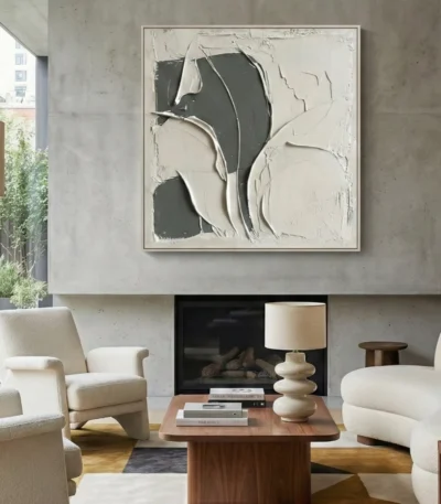 Textured abstract hand-painted canvas in cream and charcoal with layered gestural brushstrokes, contemporary living space