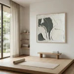 Textured abstract hand-painted canvas in charcoal and cream with layered gestural brushstrokes, contemporary yoga studio