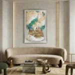 Textured hand-painted canvas depicting an abstract figure with layered scales in cream, green, and blue tones, contemporary living space