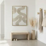 Contemporary abstract hand-painted canvas with flowing organic lines in cream and taupe tones, modern entryway
