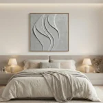 Textured abstract hand-painted canvas with flowing curved forms in white and grey tones, modern bedroom