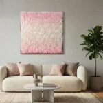 Textured abstract hand-painted canvas with gradient pink to cream brushstrokes, contemporary living space