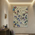 Textured contemporary wall art featuring vibrant hand-painted botanical forms on cream wave-pattern canvas, modern entryway