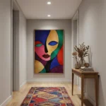 Contemporary figurative hand-painted canvas with cubist face in bold jewel tones and contrasting color blocking, hallway setting