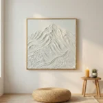 Textured monochrome hand-painted canvas depicting layered snow-capped mountain peaks in white and cream tones, minimalist interior