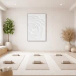Textured monochrome hand-painted canvas of an embossed white rose with subtle dimensional relief, yoga studio