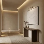 Minimalist abstract hand-painted canvas with flowing organic lines in cream and white, contemporary entryway