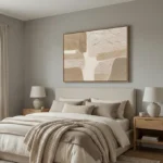 Textured abstract hand-painted canvas in cream and taupe organic forms with gestural brushwork, modern bedroom setting