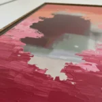Gestural abstract hand-painted canvas in layered crimson, coral, and charcoal brushstrokes with textured impasto detail