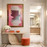 Abstract hand-painted canvas with gestural pink and grey brushstrokes, contemporary entryway