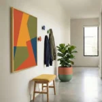 Geometric abstract hand-painted canvas in vibrant red, gold, green and blue colour blocking, contemporary entryway