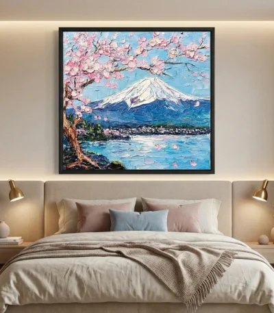 Impressionist hand-painted canvas depicting Mount Fuji with cherry blossoms, snow-capped peak, and serene lake in blue and pink tones, modern bedroom