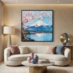 Impressionist hand-painted canvas featuring snow-capped Mount Fuji with cherry blossoms, blue water, and pink-hued palette, contemporary living space