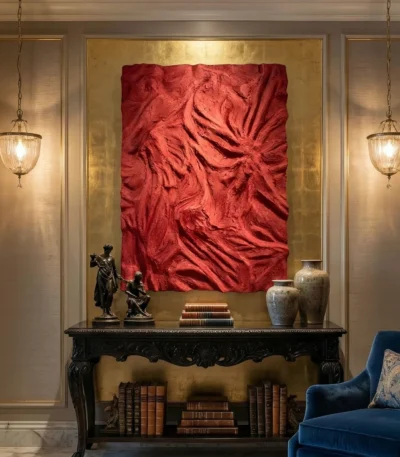 Textured abstract hand-painted canvas in deep crimson with gestural brushwork and dimensional surface, styled in contemporary living space