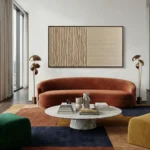 Minimalist hand-painted canvas with vertical striations in warm cream and natural tones, contemporary living space