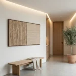 Minimalist hand-painted canvas with vertical striations in warm beige and natural wood tones, contemporary entryway