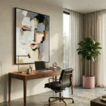 Abstract expressionist hand-painted canvas with gestural black and cream brushstrokes, ochre and grey tones, contemporary office space