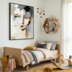 Abstract expressionist hand-painted canvas depicting stylized face in cream, ochre, and charcoal tones, modern bedroom