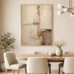 Abstract hand-painted canvas in layered cream, ochre, and taupe tones with gestural marks, contemporary dining space