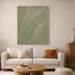 Minimalist abstract hand-painted canvas depicting aerial ocean waves in soft sage and cream tones, contemporary living space