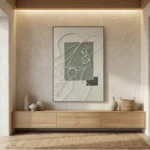 Minimalist hand-painted canvas with continuous line portrait and geometric shapes in muted sage and cream tones, contemporary entryway
