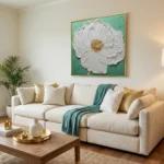 Textured contemporary hand-painted canvas depicting a white peony with gold center on soft green background, modern living space