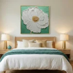 Textured contemporary hand-painted canvas of white peony with gold center on soft sage green ground, modern bedroom