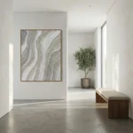 Textured abstract hand-painted canvas with undulating wave patterns in cream and gray tones, contemporary entryway