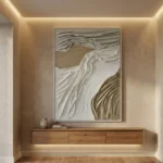 Textured abstract hand-painted canvas with flowing organic forms in cream, taupe, and bronze tones, contemporary entryway