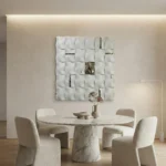 Textured abstract hand-painted canvas in white and silver with three-dimensional relief panels, contemporary dining space