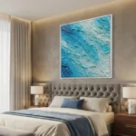 Textured abstract hand-painted canvas in layered turquoise and cream tones, contemporary bedroom setting