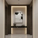 Minimalist hand-painted canvas depicting abstract female profile in monochrome line work, contemporary entryway