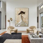 Textured figurative hand-painted canvas depicting a flowing-haired woman in cream and ivory tones, contemporary living space