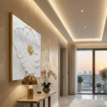 Textured hand-painted canvas of white daisy with gold leaf center in cream and champagne tones, luxury interior
