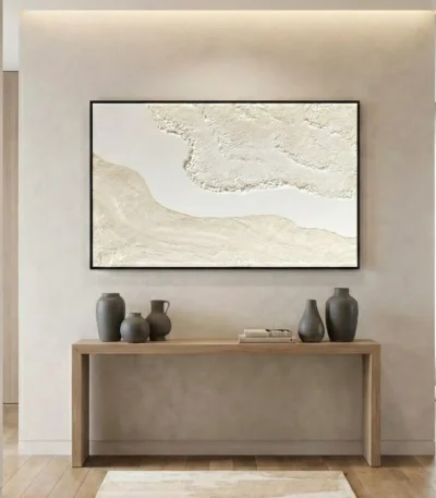 Textured abstract hand-painted canvas in cream and ivory tones with gestural brushwork, contemporary entryway